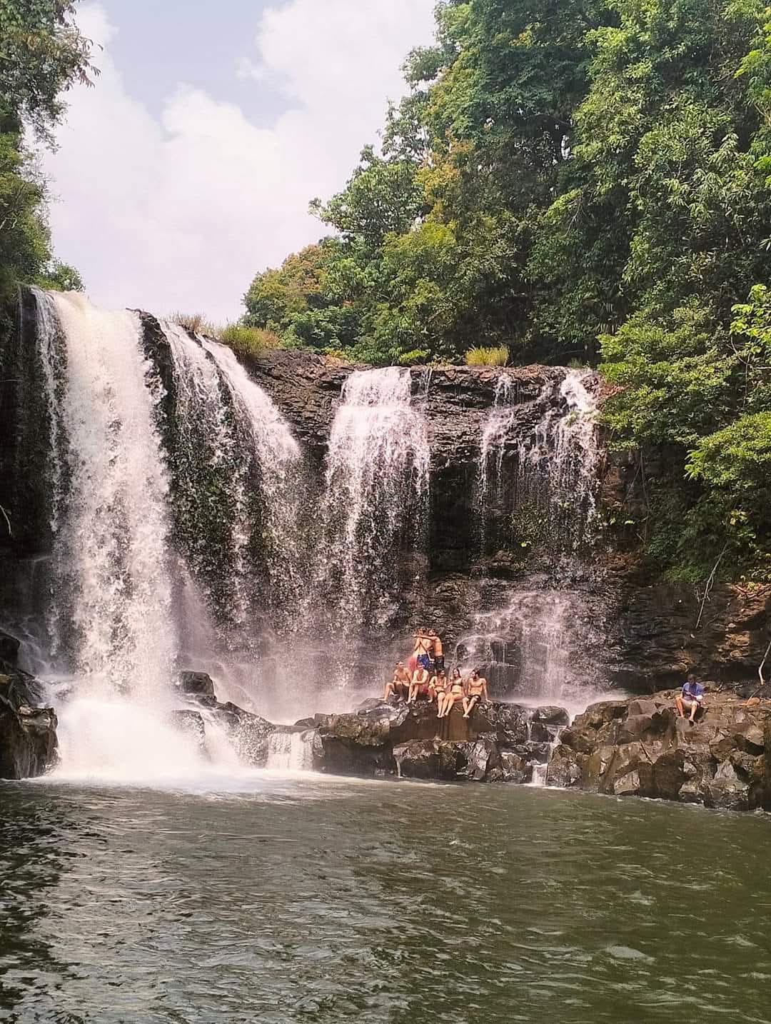 Group visiting the waterfall near Shared Happy Farm